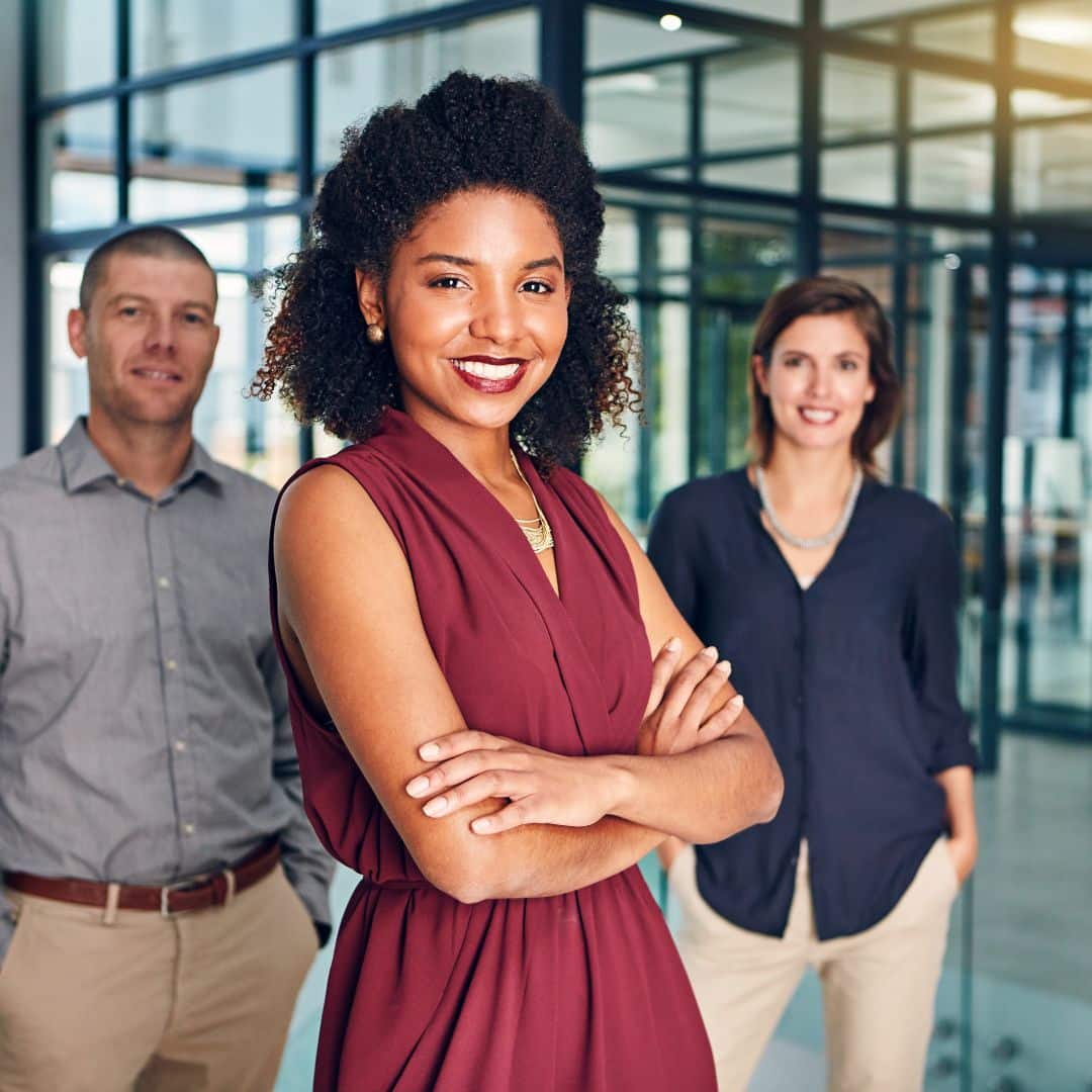 A group of confident, smiling lawyers ready to serve their clients.